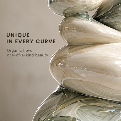 Unique in Every Curve — close-up of ivory and olive-green glazed stacked forms, organic flow one-of-a-kind beauty