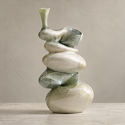 Stacked-stone spiral sculptural vase — clean product shot, multiple organic rounded forms spiraling upward with ivory and olive-green glaze
